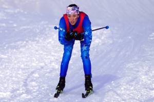 Soldotna's Tania Boonstra races towards the finish chute during the Region III Girls 7.5K Classic Race at Tsalteshi Trails near Soldotna, Alaska, on Saturday, Feb. 10, 2024. (Jake Dye/Peninsula Clarion)