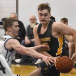 Ninilchiks Brandt Mill tries to steal the ball from Sewards Talon Lemme on Friday, February 21, 2025, at Ninilchik School in Ninilchik, Alaska. (Photo by Jeff Helminiak/Peninsula Clarion)