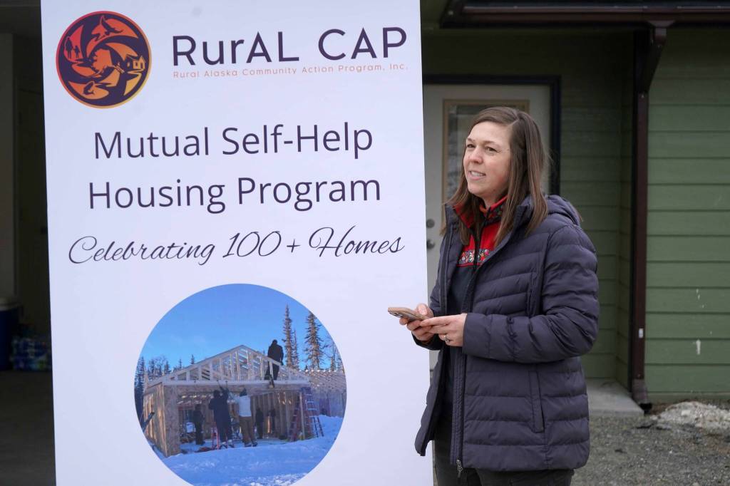 Elizabeth Milliken, chief program officer for the Rural Alaska Community Action Program, speaks at a celebration of more than 100 homes constructed by RurAL CAPs Mutual Self-Help Housing Program near Soldotna, Alaska, on Thursday, Feb. 27, 2025. (Jake Dye/Peninsula Clarion)