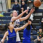 Nanwaleks Alyson Seville and Cook Inlet Academys Ella Rollman battle for the ball Saturday, March 1, 2025, at the Peninsula Conference tournament at Cook Inlet Academy just outside of Soldotna, Alaska. (Photo by Jeff Helminiak/Peninsula Clarion)