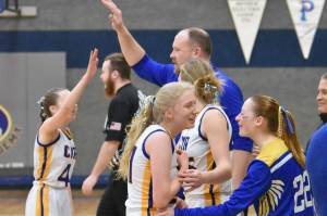 Cook Inlet Academy head coach Josh Hawley celebrates with his team Saturday, March 1, 2025, at the Peninsula Conference tournament at Cook Inlet Academy just outside of Soldotna, Alaska. (Photo by Jeff Helminiak/Peninsula Clarion)