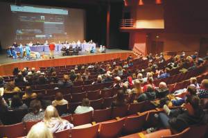 Around 100 people fill seats during a meeting of the Kenai Peninsula Borough School Districts Board of Education in Homer on Monday. (Jake Dye/Peninsula Clarion)