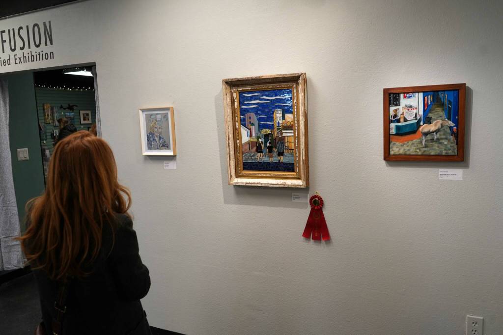 Our Happy Place by Linda Vizenor is displayed with a second-place ribbon during the opening reception for Infusion at the Kenai Art Center in Kenai, Alaska, on Friday, March 7, 2025. (Jake Dye/Peninsula Clarion)