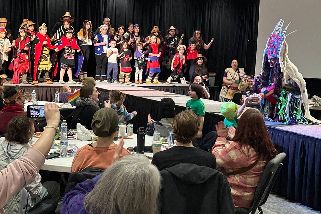 An Alaska Native dance group and Juneau Drag member perform for the audience at a Unity for the Queer Community event Sunday afternoon at Elizabeth Peratrovich Hall. (Mark Sabbatini / Juneau Empire)