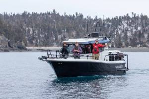 A group of volunteers during the 2024 K-Bay Sea Duck Survey. Two boats duplicate the same survey in the same area at the same time to help ensure accuracy. (Photo courtesy of Bjorn Larson)