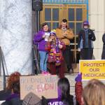 Shaine Truscot, vice president of the caregivers union SEIU 775, leads a chant at a protest against Medicaid cuts on Wednesday, March 12, 2025. (Jasz Garrett / Juneau Empire)