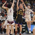 Cook Inlet Academys Owen Braband shoots between Shaktooliks Ray Sagoonick and Seth Paniptchuk at the Class 1A boys state championship game Saturday, March 15, 2025, at the Alaska Airlines Center in Anchorage, Alaska. (Photo by Jeff Helminiak/Peninsula Clarion)