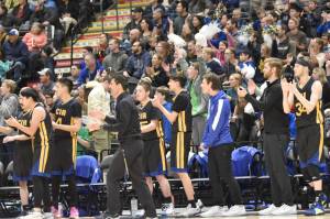 Cook Inlet Academy head coach Ben McGarry, the team and fans cheer at the Class 1A boys state championship game Saturday, March 15, 2025, at the Alaska Airlines Center in Anchorage, Alaska. (Photo by Jeff Helminiak/Peninsula Clarion)