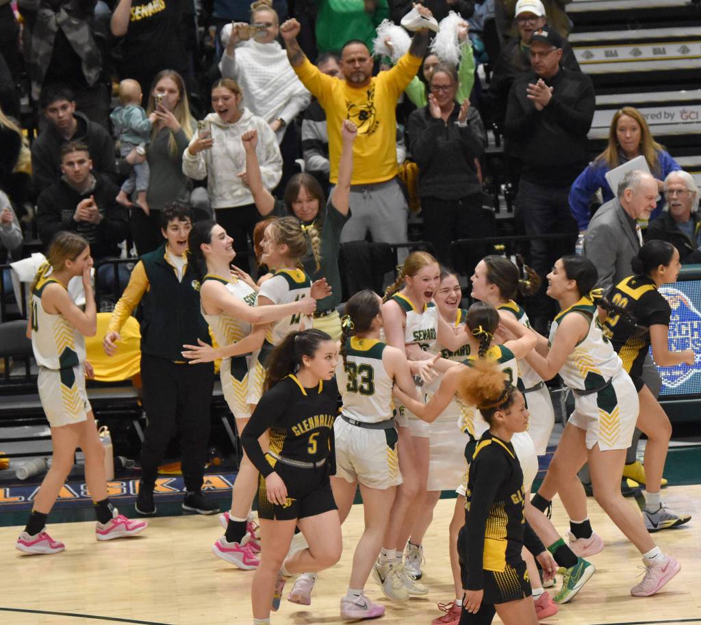 The Seward girls celebrate at the Class 2A girls state championship game Saturday, March 15, 2025, at the Alaska Airlines Center in Anchorage, Alaska. (Photo by Jeff Helminiak/Peninsula Clarion)