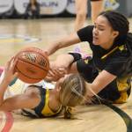Sewards Ava Jagielski and Glennallens Alianna Stone battle for the ball at the Class 2A girls state championship game Saturday, March 15, 2025, at the Alaska Airlines Center in Anchorage, Alaska. (Photo by Jeff Helminiak/Peninsula Clarion)