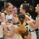 The Seward girls celebrate at the Class 2A girls state championship game Saturday, March 15, 2025, at the Alaska Airlines Center in Anchorage, Alaska. (Photo by Jeff Helminiak/Peninsula Clarion)
