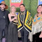 Wáatsasdiyei Joe Yates, Raye Lankford, X̱unei Lance Twitchell and Rochelle Adams pose with the Childrens and Family Emmy Award award Lankford and Twitchell won for co-writing the an episode of the PBS animated childrens show Molly of Denali. (Photo courtesy of Wáatsasdiyei Joe Yates)