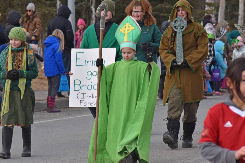 A youth dresses up for the Sweeneys St. Patricks Day Parade, Monday, March 17, 2025, in Soldotna, Alaska. (Photo by Erin Thompson/Peninsula Clarion)
