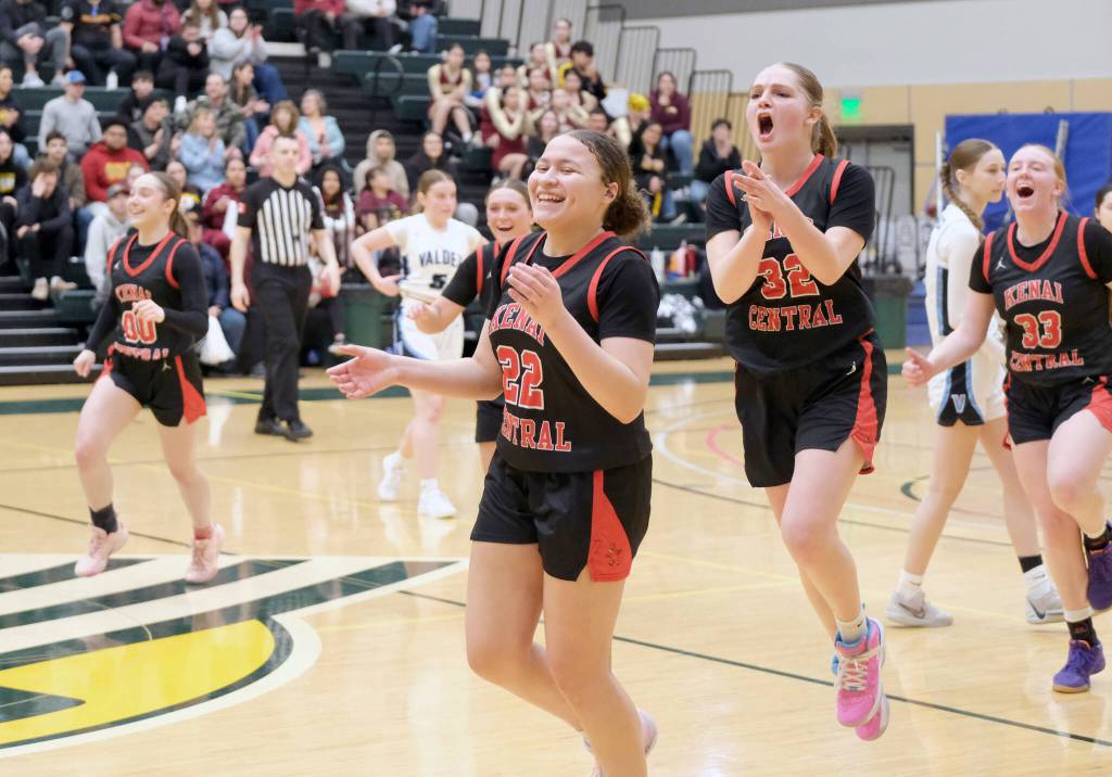 Kenai freshman Bryleigh Williams (22), junior Willow Graham (32) and Ellsi Miller (33) celebrate as they leave the court in the Kardinals 43-39 win over Valdez on Wednesday, March 19, 2025, at the 2025 ASAA March Madness Alaska 3A/4A Basketball State Championships at the Alaska Airlines Center in Anchorage, Alaska. (Klas Stolpe / Juneau Empire)