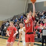 Kenai senior Caleb Litke (23) scores past Mt. Edgecumbe senior Donovan Stephan-Standifer (35) on Wednesday, March 19, 2025, in the 2025 ASAA March Madness Alaska 3A/4A Basketball State Championships at the Alaska Airlines Center in Anchorage, Alaska. (Klas Stolpe / Juneau Empire)