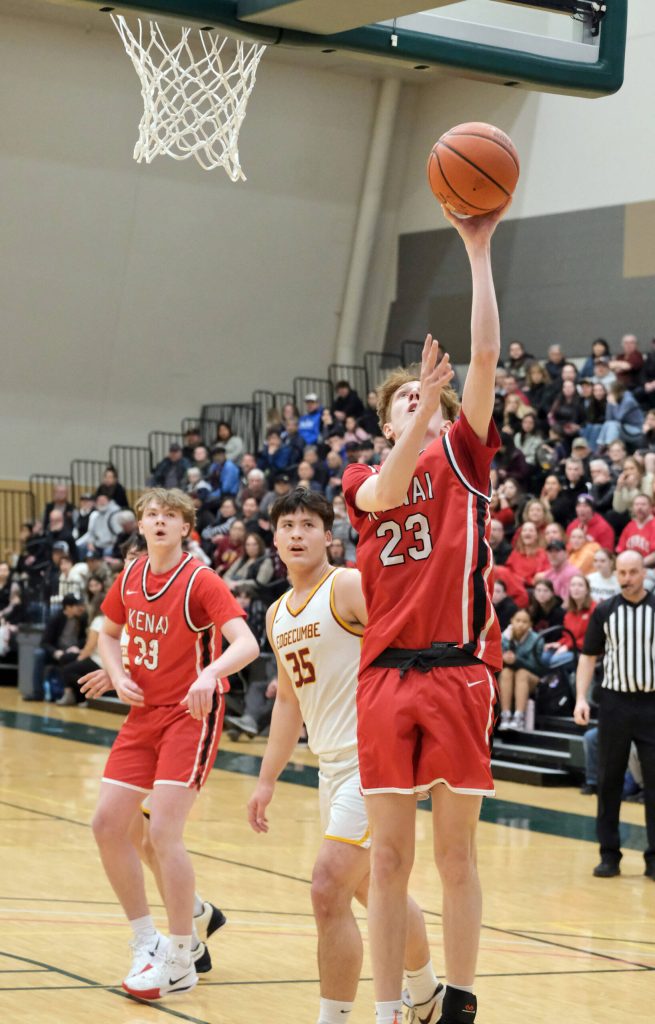 Kenai senior Caleb Litke (23) scores past Mt. Edgecumbe senior Donovan Stephan-Standifer (35) on Wednesday, March 19, 2025, in the 2025 ASAA March Madness Alaska 3A/4A Basketball State Championships at the Alaska Airlines Center in Anchorage, Alaska. (Klas Stolpe / Juneau Empire)