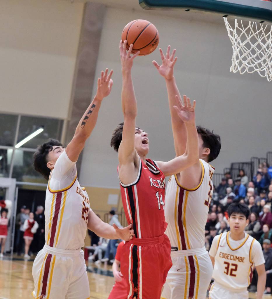 Kenai sophomore Miles Metteer (14) shoots against Mt. Edgecumbe seniors Richard Didrickson Jr (21) and Donovan Stephan-Standifer (35) on Wednesday, March 19, 2025, in the 2025 ASAA March Madness Alaska 3A/4A Basketball State Championships at the Alaska Airlines Center in Anchorage, Alaska. (Klas Stolpe / Juneau Empire)