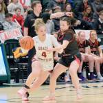 Kenais Evelyn Cooper defends Grace Christians Poppy Wiggers-Pidduck (4) during the Kardinals semifinal loss to the Grizzlies on Thursday, March 20, 2025, in the 2025 ASAA March Madness Alaska 3A/4A Basketball State Championships at the Alaska Airlines Center in Anchorage, Alaska. (Klas Stolpe / Juneau Empire)