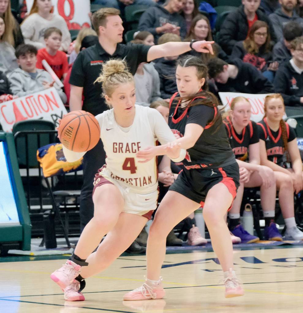 Kenais Evelyn Cooper defends Grace Christians Poppy Wiggers-Pidduck (4) during the Kardinals semifinal loss to the Grizzlies on Thursday, March 20, 2025, in the 2025 ASAA March Madness Alaska 3A/4A Basketball State Championships at the Alaska Airlines Center in Anchorage, Alaska. (Klas Stolpe / Juneau Empire)
