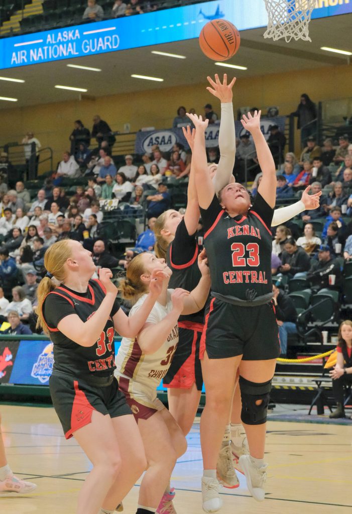 Kenais Ellsi Miller (33), Willow Graham (32) and McKenzie Spence (23) go for a rebound with Grace Christians Madeline Ayers (left) and Sophie Lentfer (behind) during the Kardinals semifinal loss to the Grizzlies on Thursday, March 20, 2025, in the 2025 ASAA March Madness Alaska 3A/4A Basketball State Championships at the Alaska Airlines Center in Anchorage, Alaska. (Klas Stolpe / Juneau Empire)