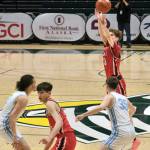 Kenais Caleb Litke (23) shoots over Valdezs Zachary Holbrook (35) during the Kardinals 71-49 loss to the Buccaneers on Friday, March 21, 2025, in the 4th/6th place game of the 2025 ASAA March Madness Alaska 3A/4A Basketball State Championships at the Alaska Airlines Center in Anchorage, Alaska. (Klas Stolpe / Juneau Empire)