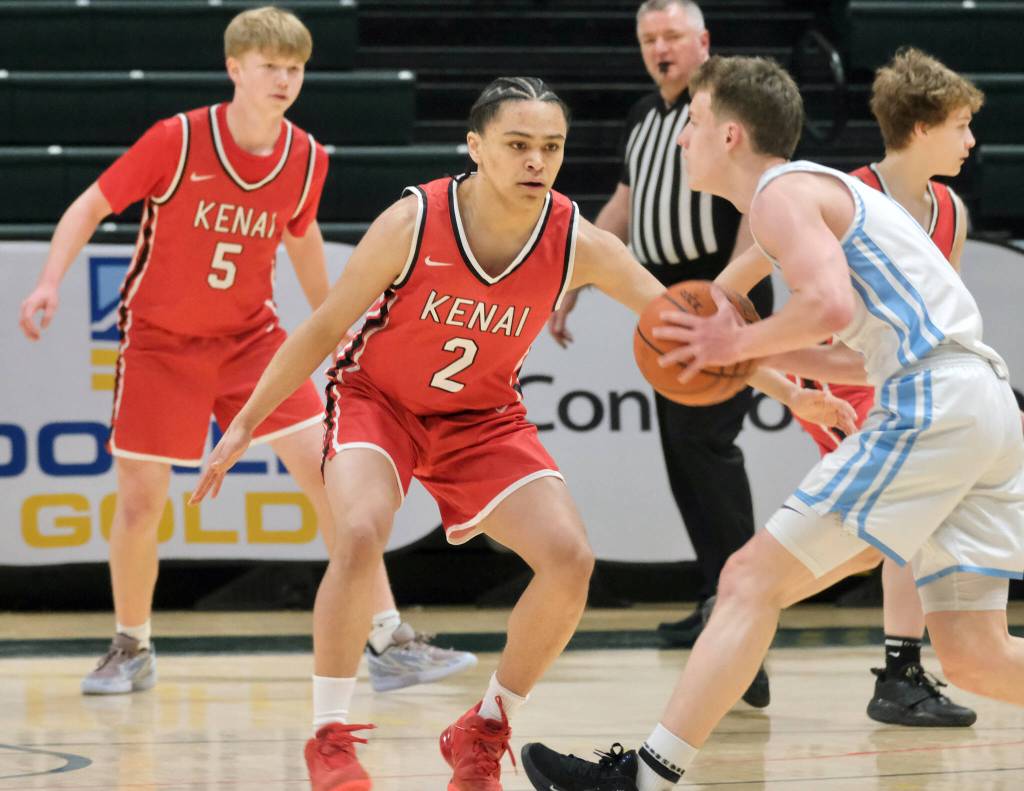 Kenais Garrett McCanna defends Valdezs Jarrett Gage during the Kardinals 71-49 loss to the Buccaneers on Friday, March 21, 2025, in the 4th/6th place game of the 2025 ASAA March Madness Alaska 3A/4A Basketball State Championships at the Alaska Airlines Center in Anchorage, Alaska. (Klas Stolpe / Juneau Empire)