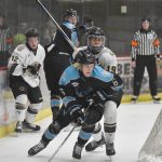 Jackson Ernst of the Wisconsin Windigo shields the puck from Luke Lizak of the Kenai River Brown Bears on Saturday, March 22, 2025, at the Soldotna Regional Sports Complex in Soldotna, Alaska. (Photo by Jeff Helminiak/Peninsula Clarion)