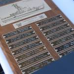 A plaque on display at the decommissioning ceremony on Friday, March 21, 2025, lists the Naushons former commanding officers, in Homer, Alaska. (Chloe Pleznac/Homer News)