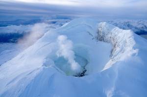 In an undated photo provided by Wyatt Mayo/Alaska Volcano Observatory shows Mount Spurr, in October, which is being monitored for signs that it is moving closer to erupting. A spending freeze could disrupt systems that warn communities when eruptions appear imminent. (Wyatt Mayo/Alaska Volcano Observatory, U.S. Geological Survey via The New York Times)