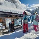 An instructor talks with students during SnowSchool. The program provides students with knowledge of basic snow science and hydrology using an experiential, inquiry-based teaching model and helps model and cultivate stewardship behaviors. (Photo courtesy of KMTA)