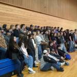 Students and hosts stand for a photo during a luncheon at the end of SoHis first Job Shadow Day, Wednesday, March 26, 2025, at Soldotna Prep School in Soldotna, Alaska. (Jake Dye/Peninsula Clarion)