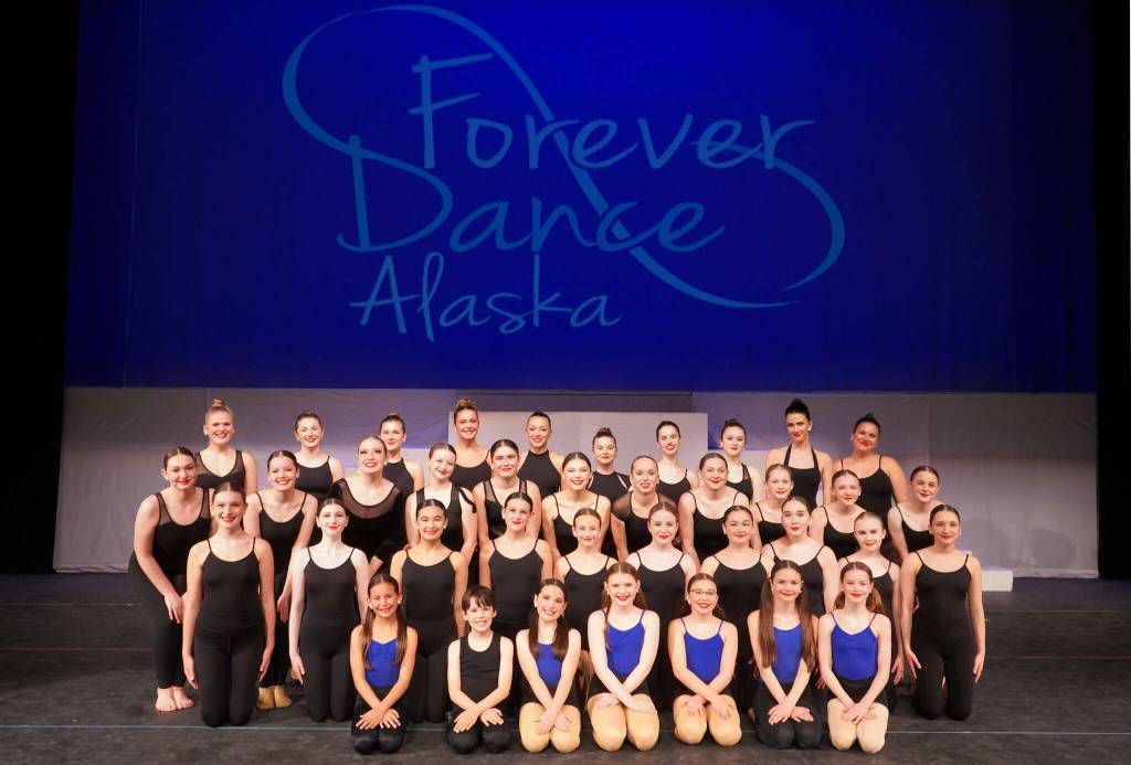 Dancers appear for a photo during a rehearsal of Forever Dances 10th Anniversary Company Showcase, Down Memory Lane, at Kenai Central High School in Kenai, Alaska, on Wednesday, March 26, 2025. (Jake Dye/Peninsula Clarion)