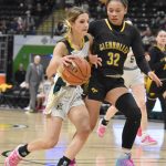 Sewards Ava Jagielski drives on Glennallens Brejanay Stone-Jordan at the Class 2A girls state championship game Saturday, March 15, 2025, at the Alaska Airlines Center in Anchorage, Alaska. (Photo by Jeff Helminiak/Peninsula Clarion)