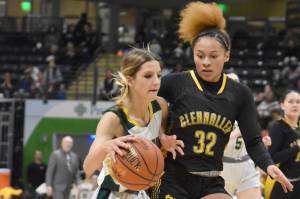 Seward's Ava Jagielski drives on Glennallen's Brejanay Stone-Jordan at the Class 2A girls state championship game Saturday, March 15, 2025, at the Alaska Airlines Center in Anchorage, Alaska. (Photo by Jeff Helminiak/Peninsula Clarion)