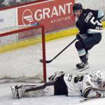 Kenai River Brown Bears goalie Owen Zenone saves a breakaway by Cole Christian on Saturday, March 29, 2025, at the Soldotna Regional Sports Complex in Soldotna, Alaska. (Photo by Jeff Helminiak/Peninsula Clarion)