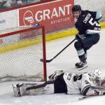 Kenai River Brown Bears goalie Owen Zenone saves a breakaway by Cole Christian on Saturday, March 29, 2025, at the Soldotna Regional Sports Complex in Soldotna, Alaska. (Photo by Jeff Helminiak/Peninsula Clarion)