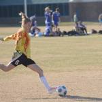 Rachel Johnson kicks the ball in May 2014 for the Nikiski soccer team at Nikiski Middle-High School in Nikiski, Alaska. (Clarion file)