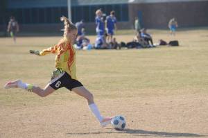 Rachel Johnson kicks the ball in May 2014 for the Nikiski soccer team at Nikiski Middle-High School in Nikiski, Alaska. (Clarion file)