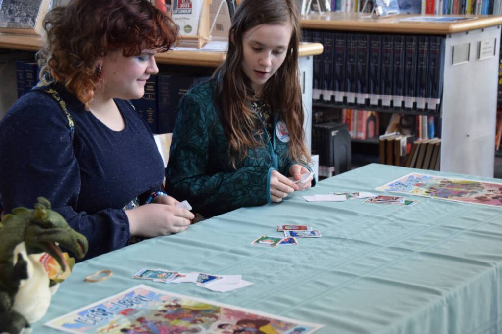 Students play a card game at the center of this years upcoming Summer Reading Program during the annual Celebration of Lifelong Learning event at the Homer Public library on Saturday, March 29, 2025. (Chloe Pleznac/Homer News)