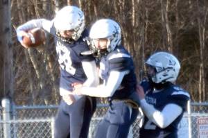 Soldotna's Wyatt Faircloth celebrates his touchdown with Owen Buckbee and Dalton Armstrong on Saturday, Oct. 26, 2024, at the First National Bowl Division II title game at Pride Field at Colony High School in Palmer, Alaska. (Photo by Jeff Helminiak/Peninsula Clarion)