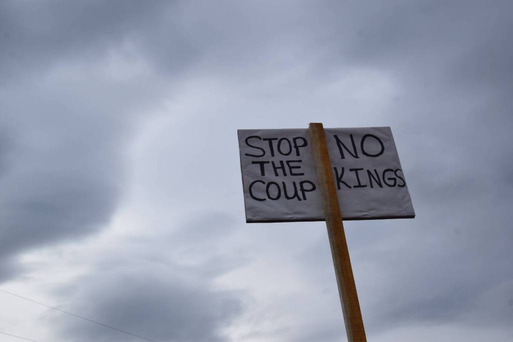 A sign seen during the nationwide Hands Off! protest on Saturday, April 5 at WKFL Park in Homer, Alaska. (Chloe Pleznac/Homer News)