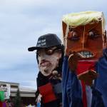 Artist Charles Aguilars puppets arrive at the Hands Off! protest on Saturday, April 5 at WKFL Park in Homer, Alaska. (Chloe Pleznac/Homer News)