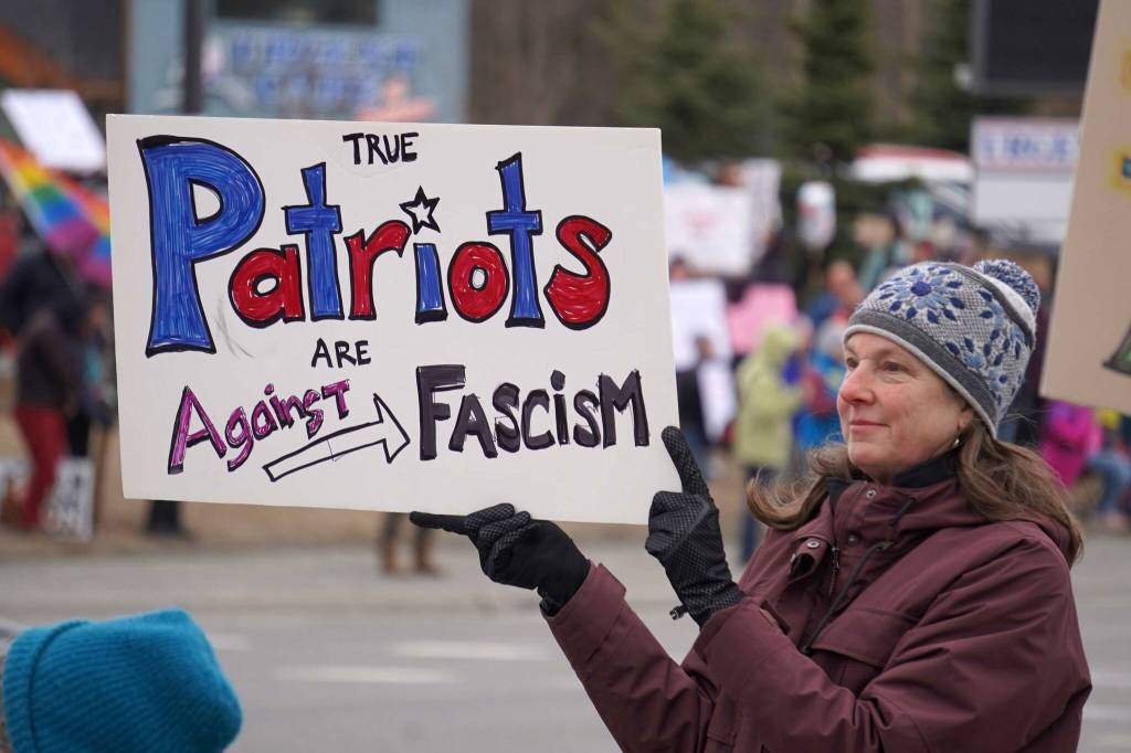 Protesters stand along the Sterling Highway in Soldotna, Alaska, participating in the Remove, Reverse, Reclaim protest organized by Many Voices and Kenai Peninsula Protests as part of the nationwide 50501 effort on Saturday, April 5, 2025. (Jake Dye/Peninsula Clarion)