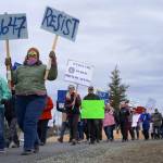 Protesters walk through Soldotna Creek Park in Soldotna, Alaska, participating in the Remove, Reverse, Reclaim protest organized by Many Voices and Kenai Peninsula Protests as part of the nationwide 50501 effort on Saturday, April 5, 2025. (Jake Dye/Peninsula Clarion)