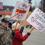 Protesters stand along the Sterling Highway in Soldotna, Alaska, participating in the Remove, Reverse, Reclaim protest organized by Many Voices and Kenai Peninsula Protests as part of the nationwide 50501 effort on Saturday, April 5, 2025. (Jake Dye/Peninsula Clarion)