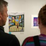 Attendees view the 34th Annual Visual Feast Kenai Peninsula Borough School District Juried Student Art Show during an opening reception at the Kenai Art Center in Kenai, Alaska, on Friday, April 4, 2025. (Jake Dye/Peninsula Clarion)