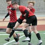 Kenai Centrals Ryker Dykema (front) celebrates his goal against Clarkston (Washington) with Miles Metteer and Zane James on Monday, April 7, 2025, at Ed Hollier Field at Kenai Central High School in Kenai, Alaska. (Photo by Jeff Helminiak/Peninsula Clarion)