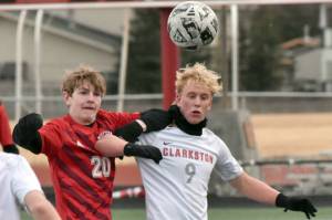 Levi Strong of Kenai Central and Stephen Alfred of Clarkston (Washington) battle for the ball Monday, April 7, 2025, at Ed Hollier Field at Kenai Central High School in Kenai, Alaska. (Photo by Jeff Helminiak/Peninsula Clarion)