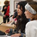 Stefany Montague and Georgia Christmas, students of Kenai Alternative High School, speak during a meeting of the Kenai Peninsula Borough School Districts Board of Education in Soldotna, Alaska, on Monday, April 7, 2025. (Jake Dye/Peninsula Clarion)