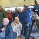 Chloe Pleznac/Homer News
Community members who support education funding stand up during the virtual town hall with Rep. Sarah Vance on Saturday in the Pioneer Hall at Kachemak Bay Campus.